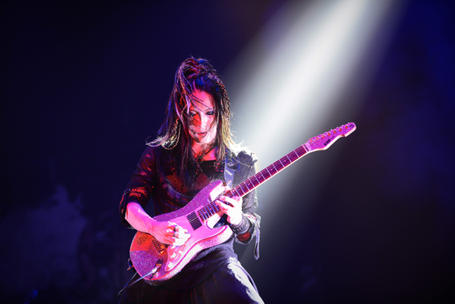 Ohmura performing with Marty Friedman